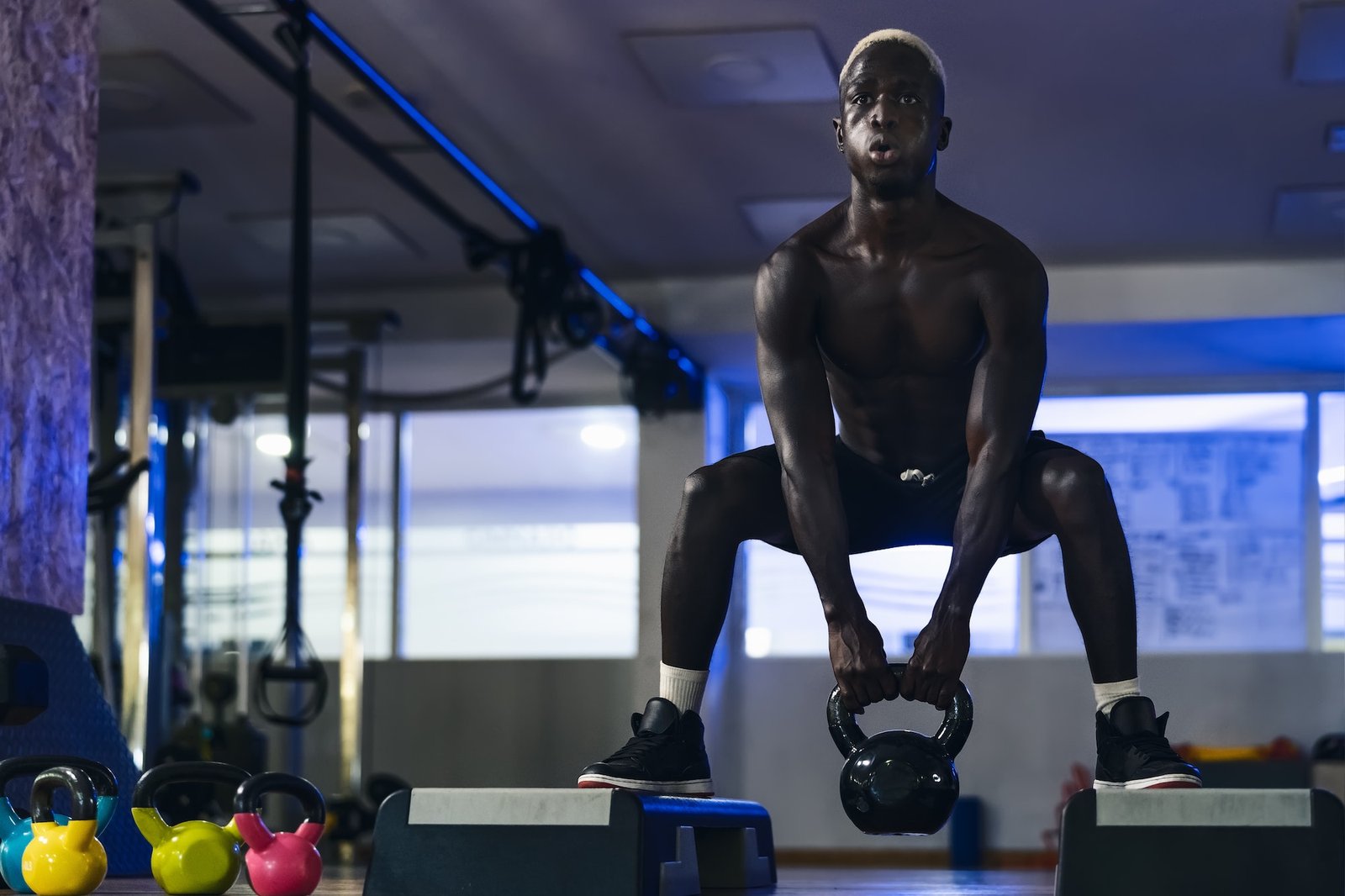 Young African man training inside gym